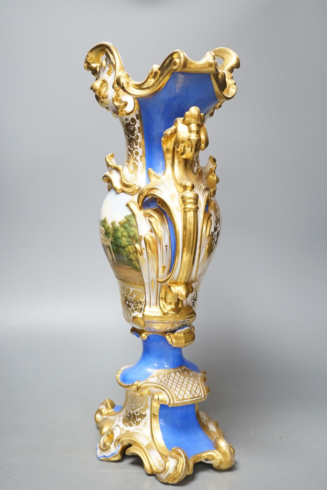 An early 19th century Paris porcelain vase in Feuillet style painted with a folly 44cm